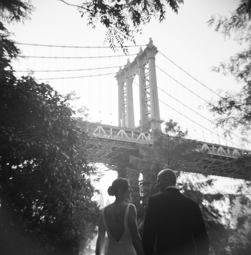 Bride and groom in front of bridge taken by Christian Noble, wedding photographers tampa
