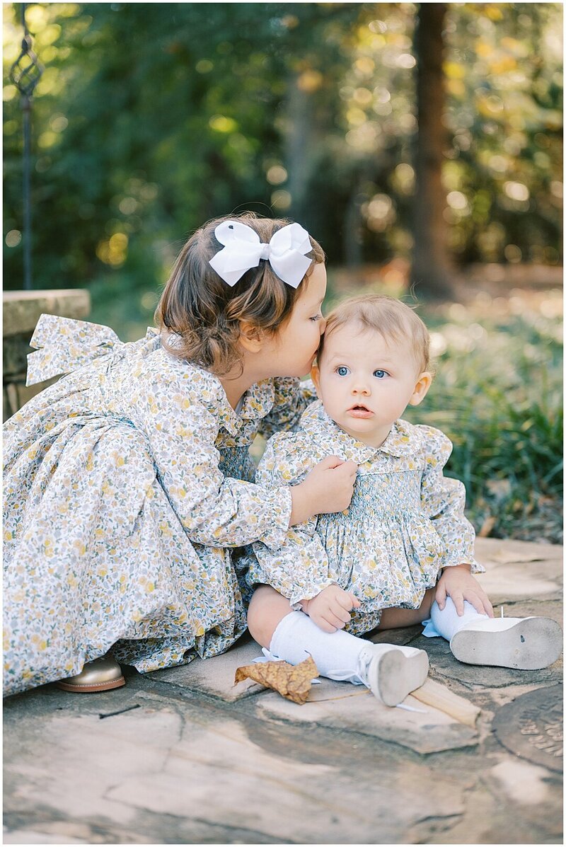 big sister giving little sister a kiss Atlanta Family Photographer