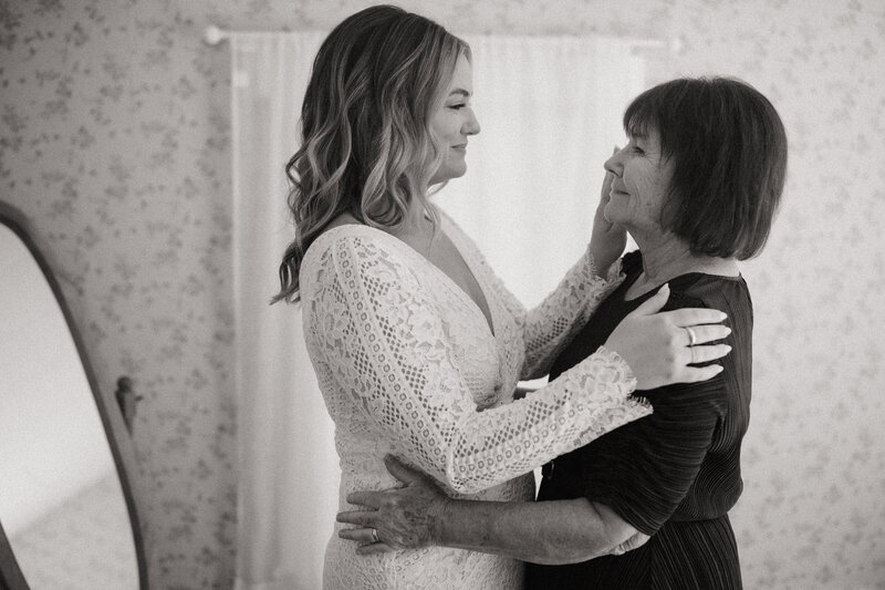 mother and daughter black and white image on wedding morning