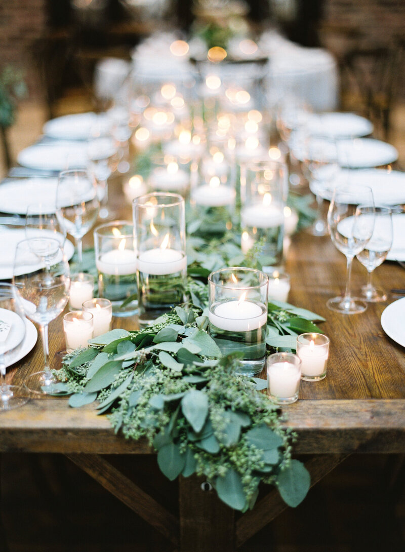 wedding tablescape with greenery and white candles