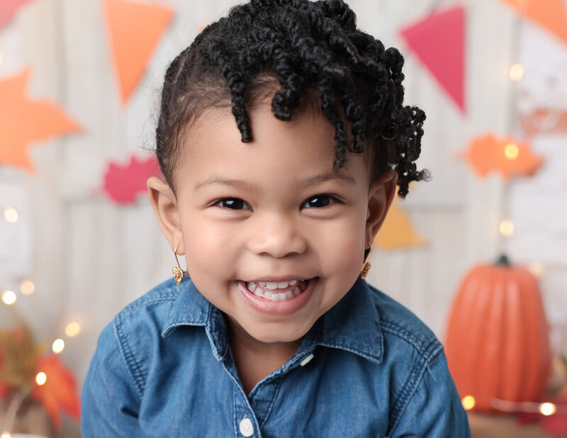 Smiling two year old at our Rochester, Ny studio.