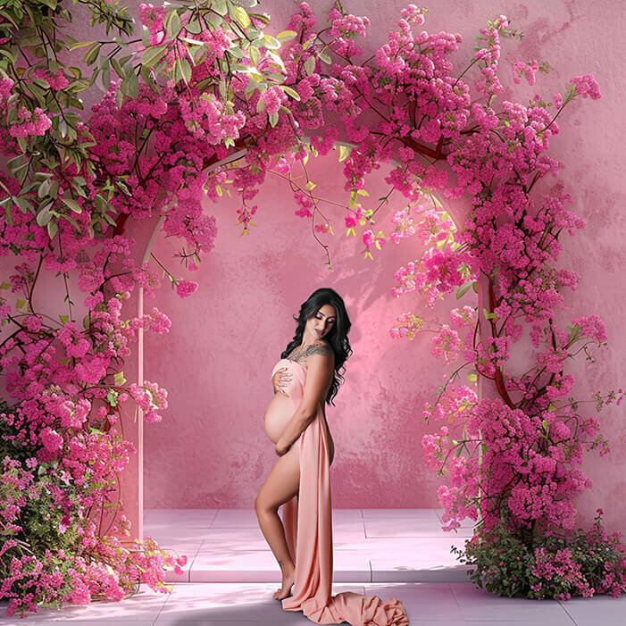 Gorgeous momma to be posing in just fabric in front of arched floral digital backdrop.