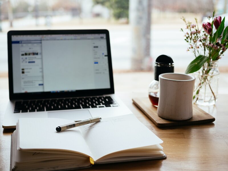 laptop with coffee and notepad