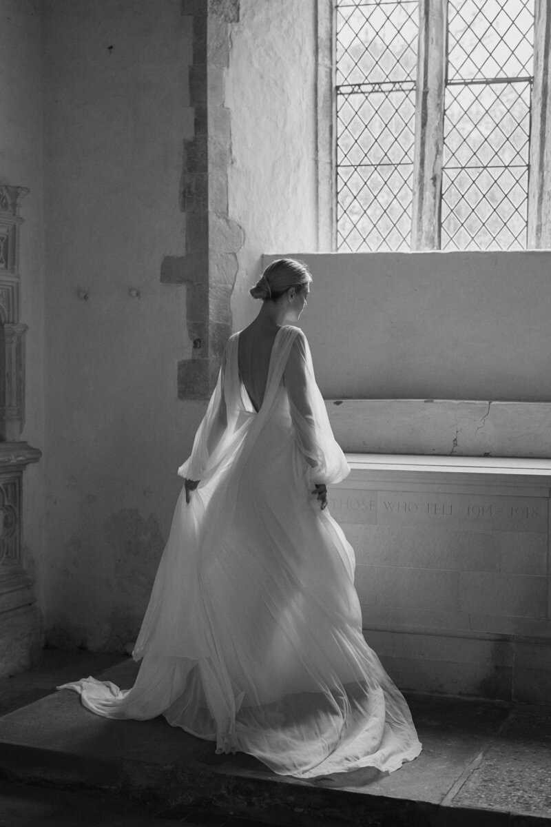 Flowing silk wedding dress with deep v neck back design by Luna Bea, British Bridal Designer