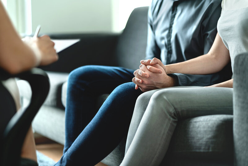 Therapist guiding couple through intensive therapy session focused on trust, communication, and reconnection