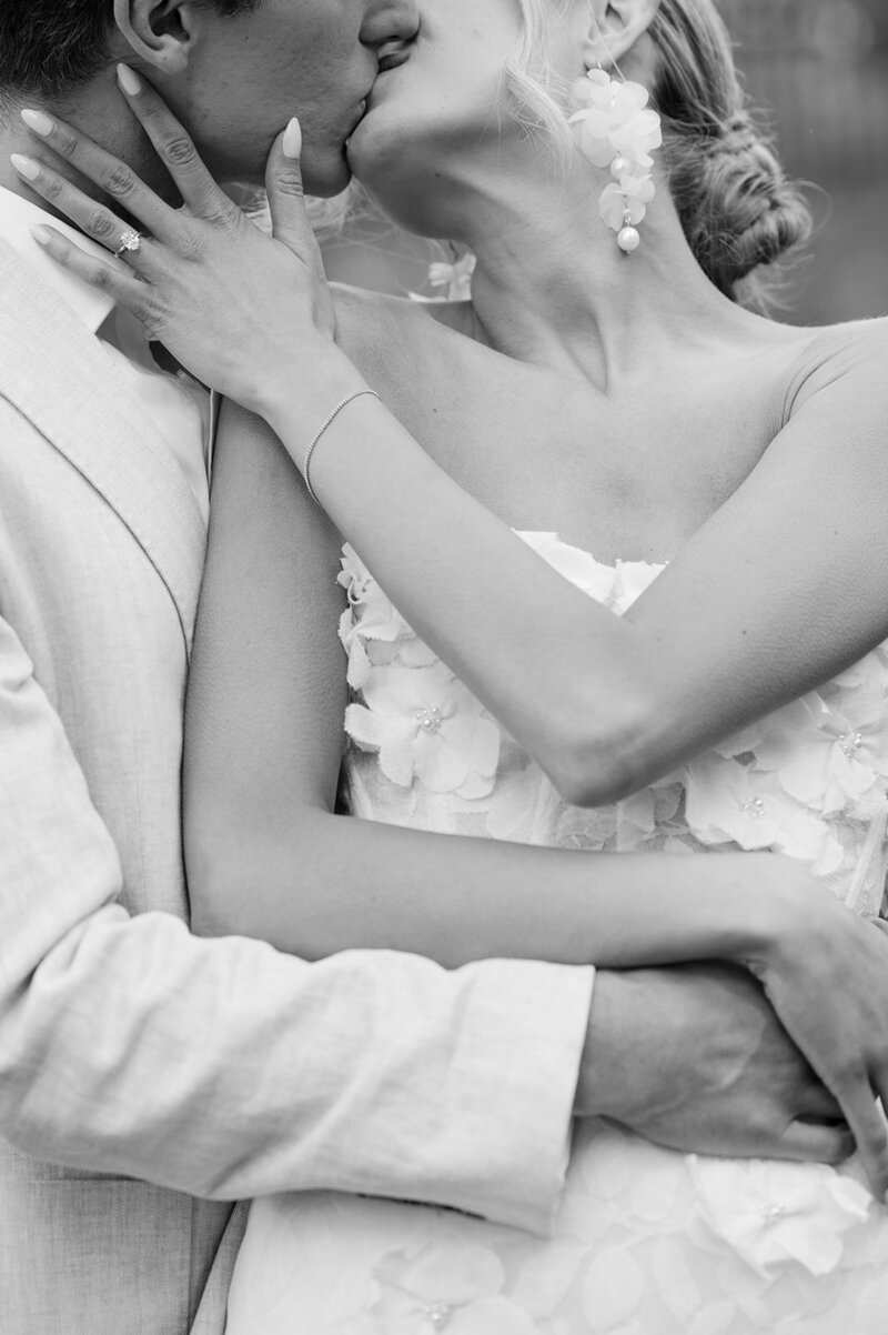 Bride and Groom share a kiss. Close up image by Sarah Woods Photography