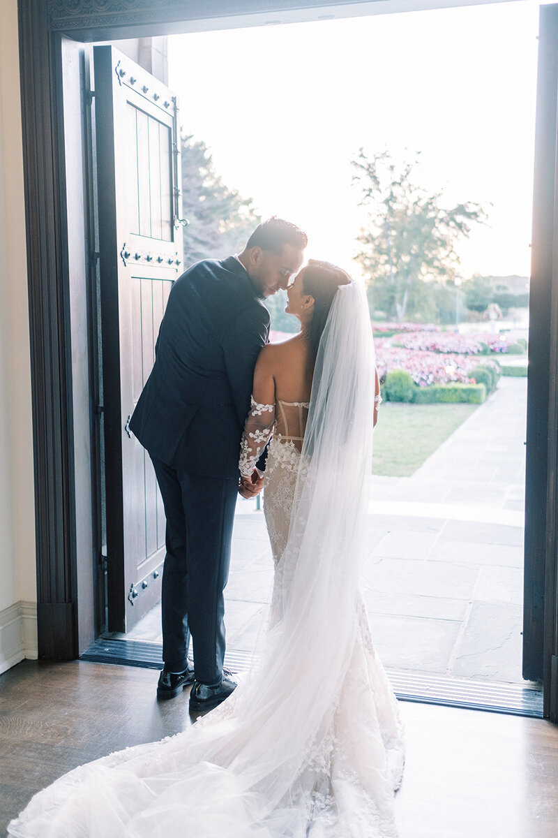 Fashionable and stylish black tie spring wedding with white roses and orchids, Berta wedding gown, and YSL bridal shoes at an Estate with French-inspired architecture and ambiance | Park Chateau Estate and Gardens | East Brunswick NJ | Denise Marie Photography | Editorial Wedding Photographer based in Philadelphia PA