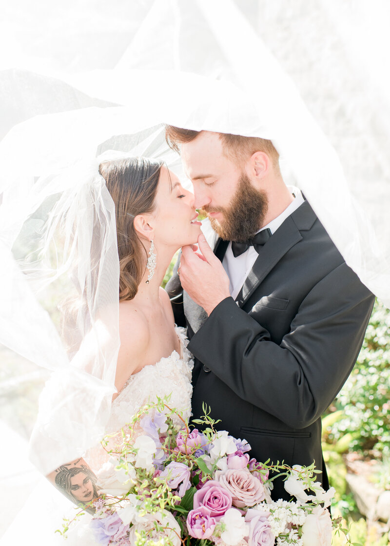 Wedding Photographer, bride and groom holds ands and excitedly laugh, they're married