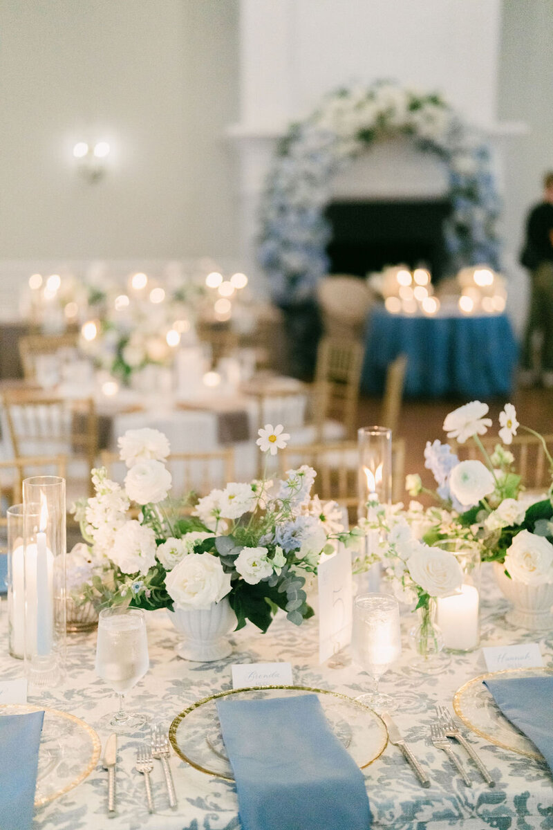 Luxury estate wedding reception in North Carolina featuring elegant white and green florals with pops of blue. Luxury wedding planner. Raleigh wedding. 
