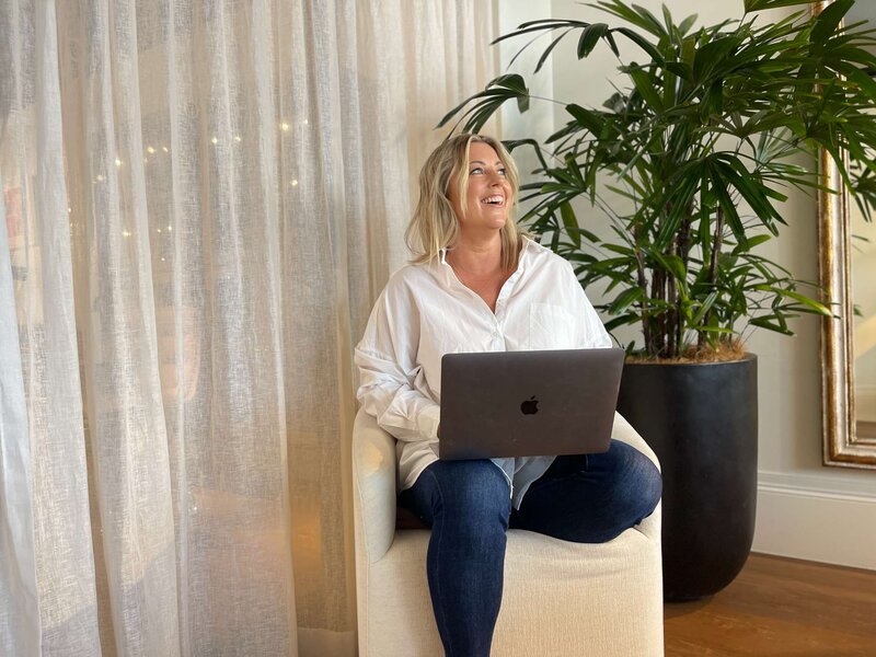rebecca laughing with laptop