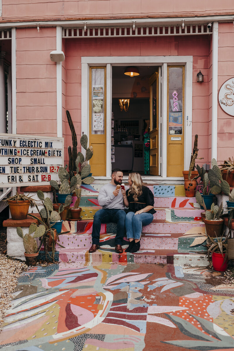 couple eating ice cream outside a colorful ice cream shop in savannah