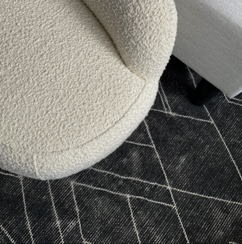 Boucle Accent Chair and Dark Neutral Rug