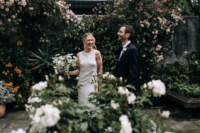 bride groom first dance country hall laughing new zealand geraldine with fairy lights white dress pearls