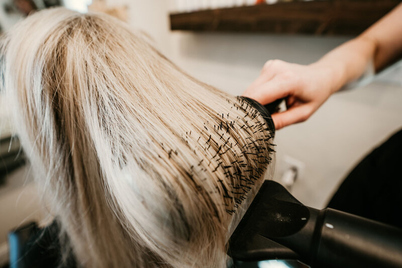 Blow-dry in progress—stylist rounds out a customized service at Maven + Grace.
