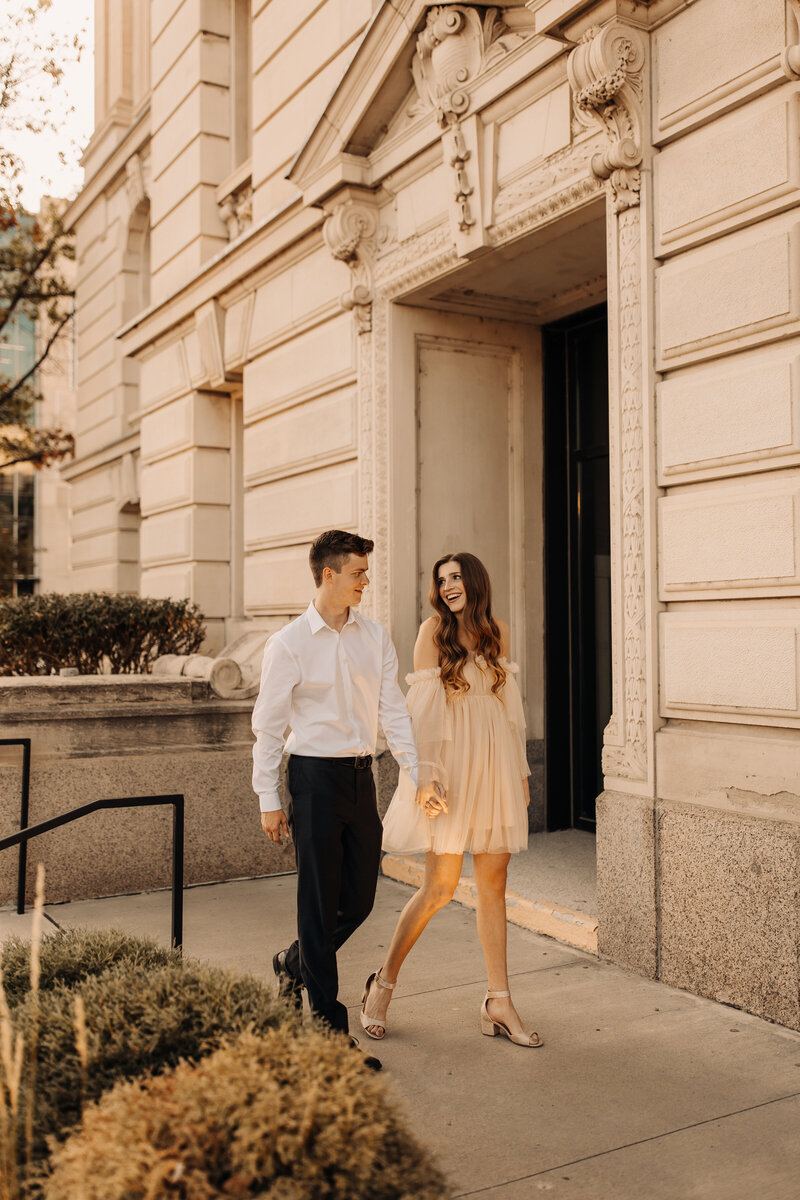 downtown engagement session photos with pink tulle dress