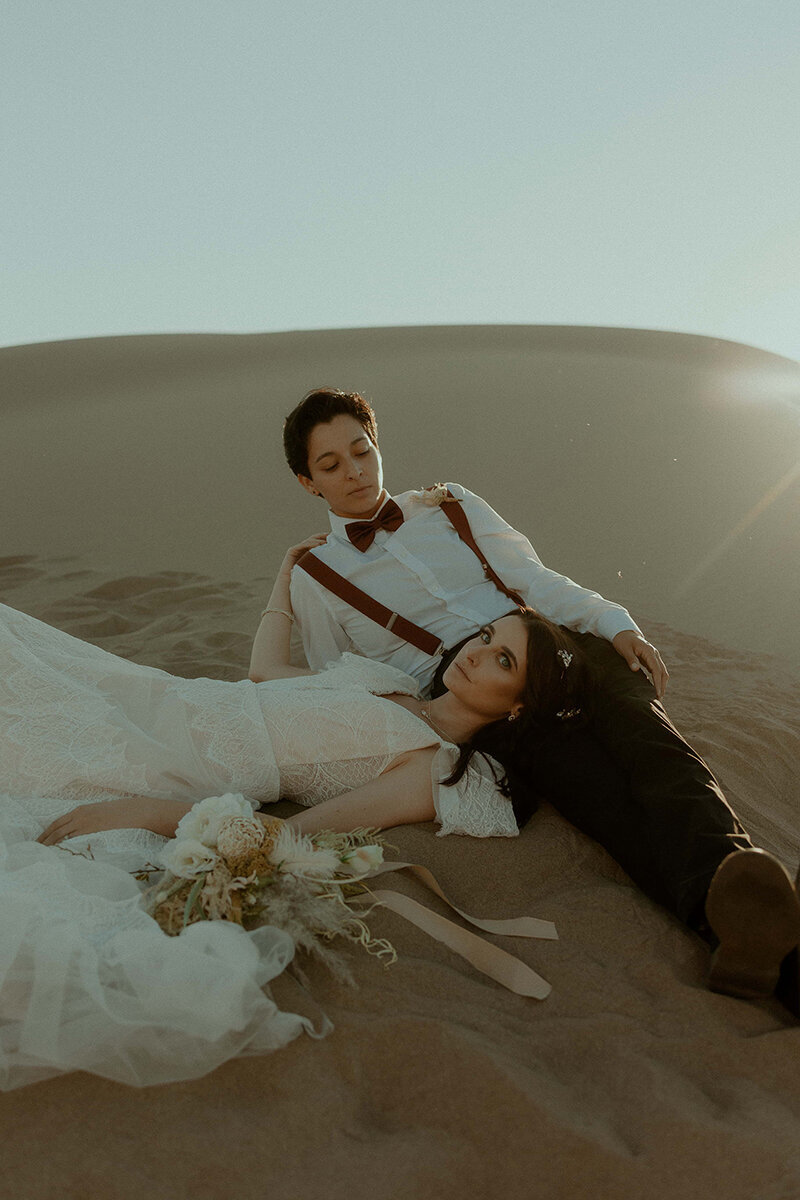 couple cuddling on dune