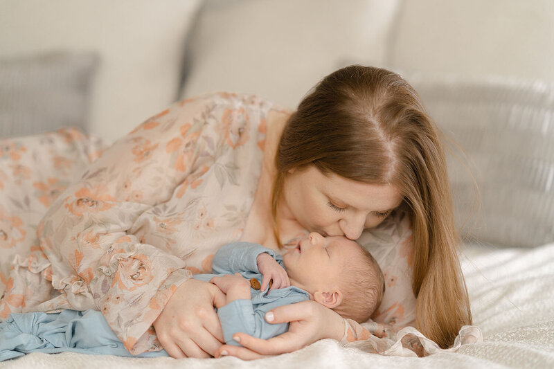 mom kiss baby during Fairfax County, VA newborn photography