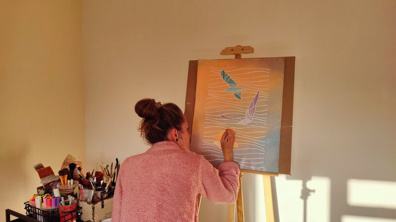 Emele Artist painting sunrise birds