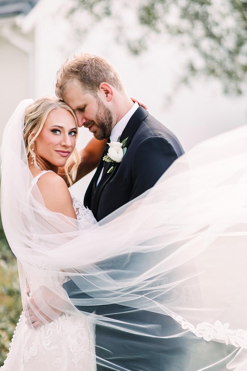 A stunning bride surrounded by her bridesmaids, all featuring flawless hair and makeup by Mistique Makeup. Discover the beauty and elegance that our expert team brings to each wedding, creating unforgettable looks for the entire bridal party.