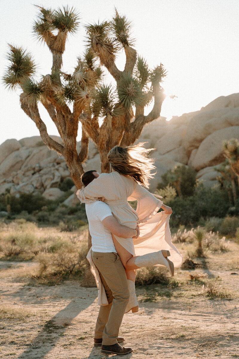 a newly engaged couples at joshua tree national park
