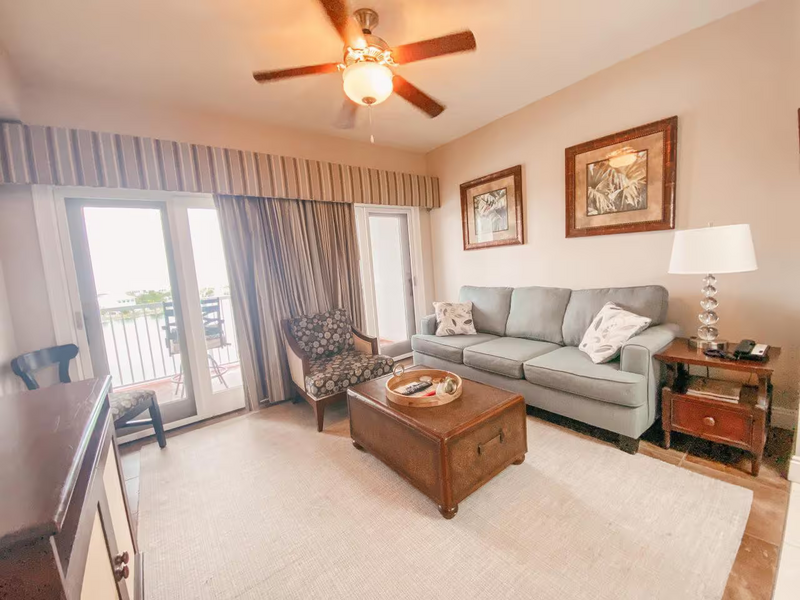 living room with blue couch and brown coffee table