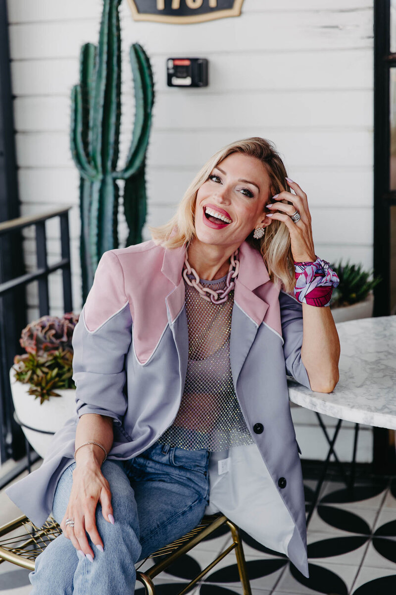 Charla Corn Barrrett laughing wearing fashionable outfit | Charisma Coach for Driven Women