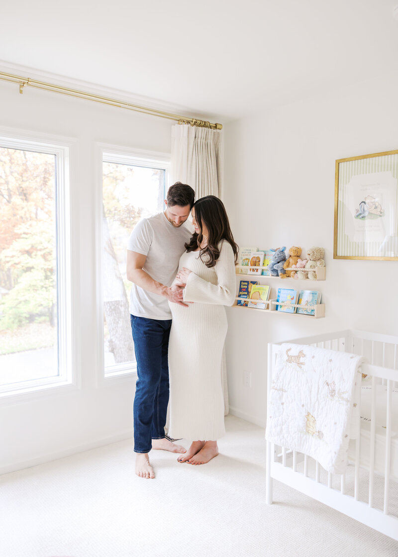 Husband and wife during their In-home maternity photography session in minnetonka, mn with angela watts photography.