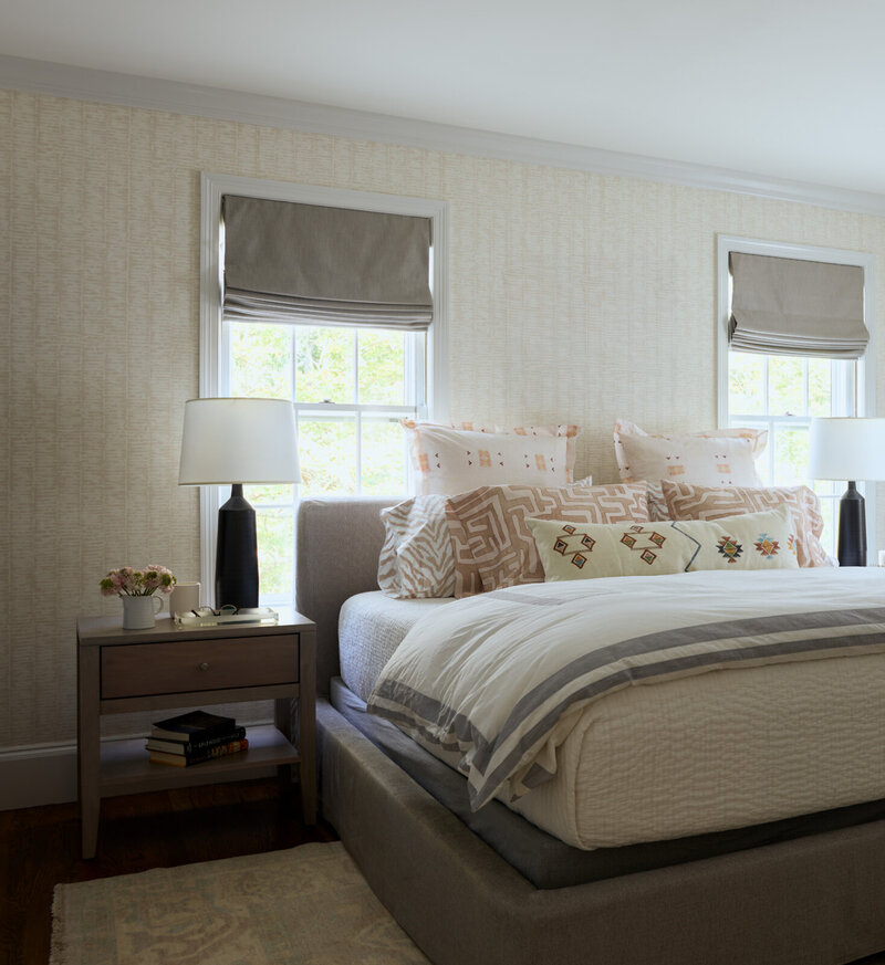 Boston interior decorator creates a primary bedroom in a historic Hingham home, blending timeless architecture with contemporary furniture and art.