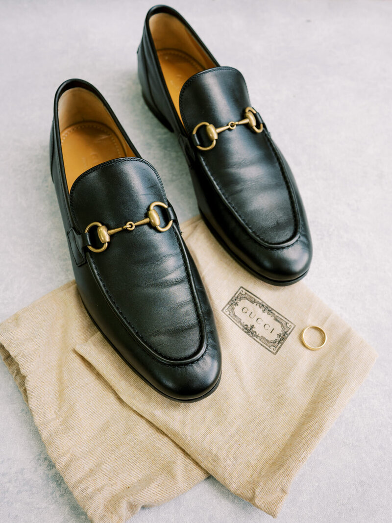 Gucci shoes and gold ring. Groom detail shot.