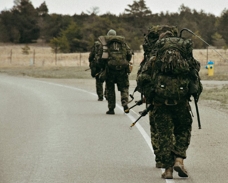 Military leaders on foot patrol representing frontline leadership under pressure