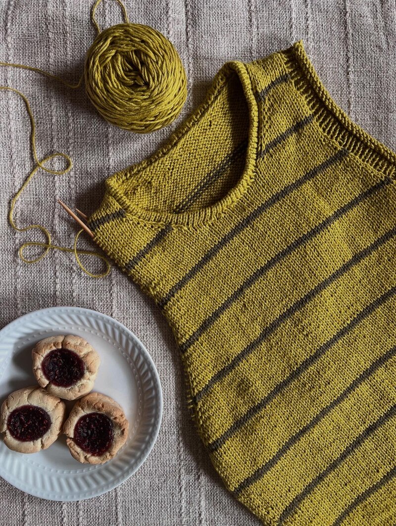 Flay lay of Take Turns Tank WIP with plate of cookies