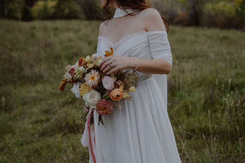 Bride holds bouquet in her hand