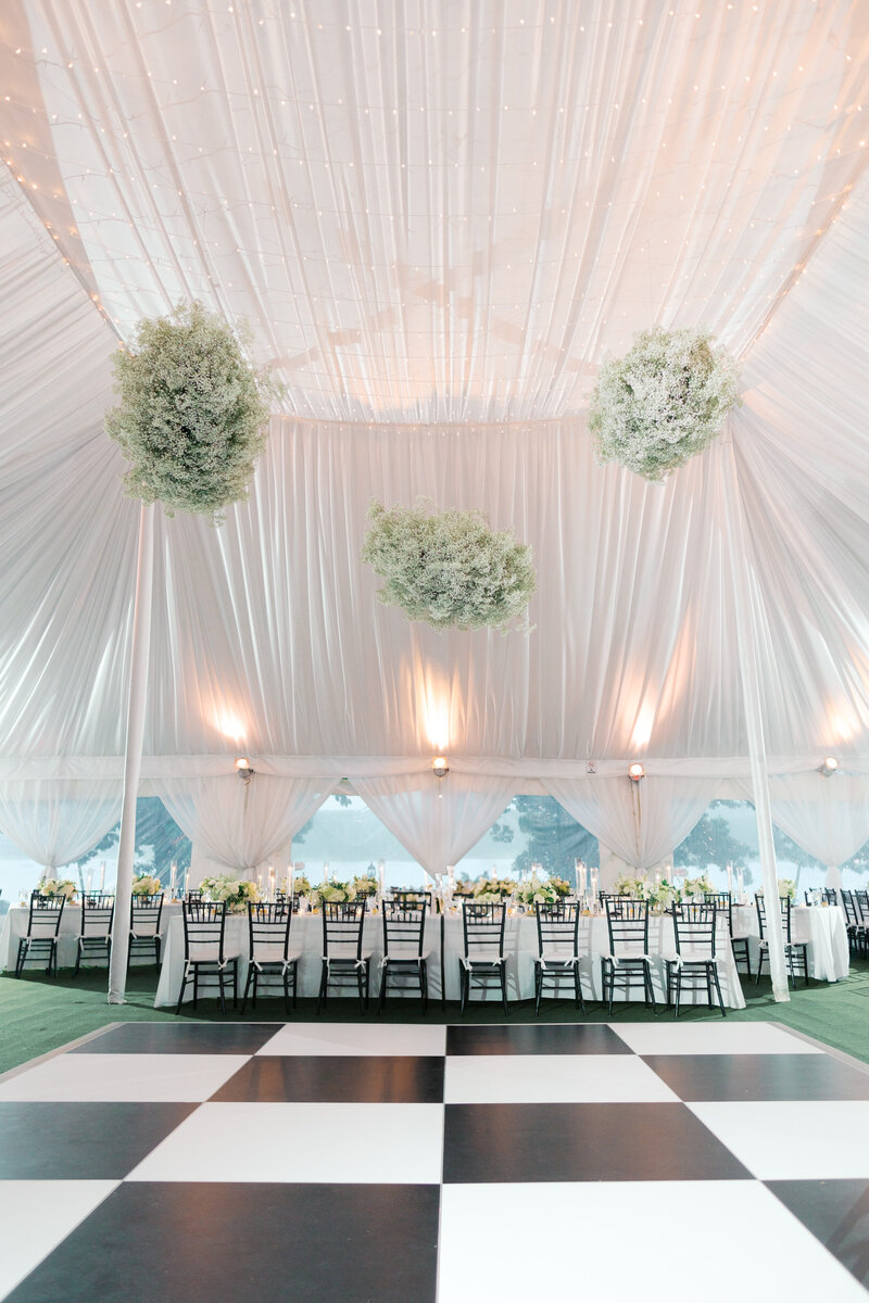 Tented black and white elegant wedding reception details at the Wainwright House in Rye, New York