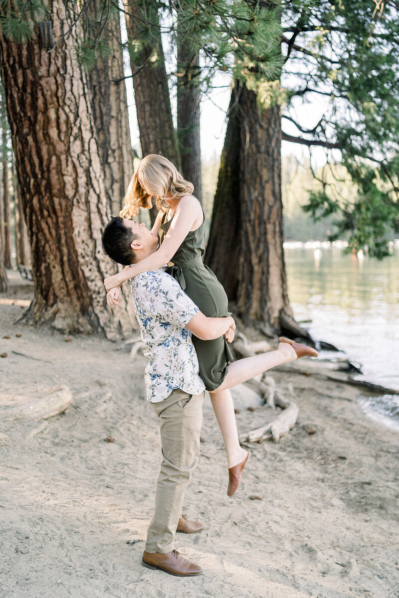 A playful and joyful engagement session by the shores of Lake Tahoe, California, photographed by Tiffany Longeway Photography.