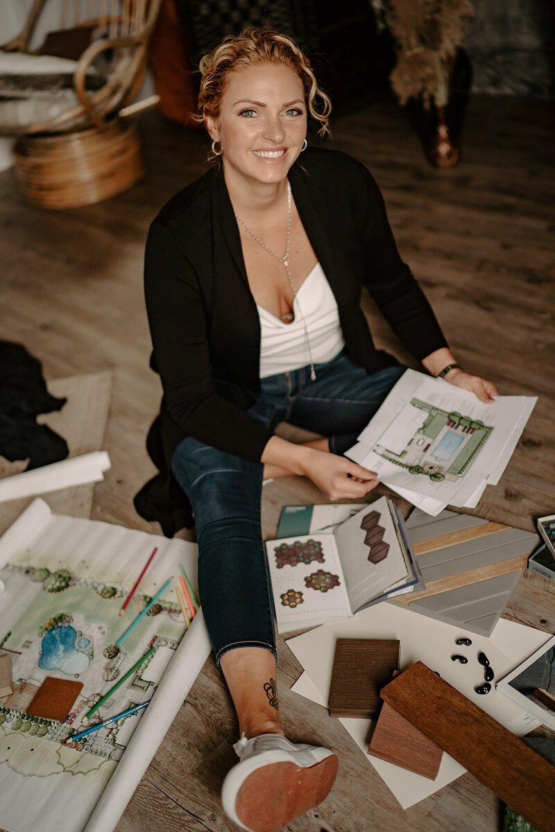 meaghan sitting with landscape design plan