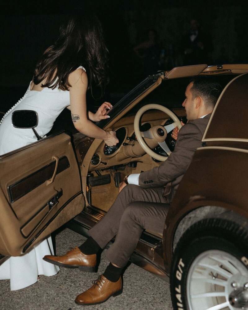 couple and a vintage car on their wedding day, elsie goodman wedding photography prices