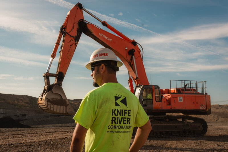 construction man in front of excavator