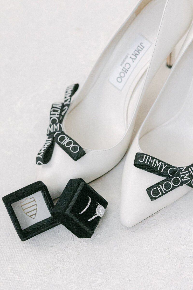 black and white bridal shoes and wedding rings