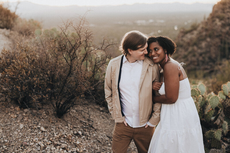 Couple at gates pass at sunset.