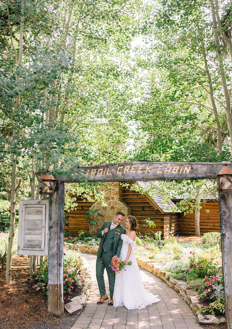 Bride being escorted down the aisle by her father during outdoor wedding ceremony captured by La Bella Vita Photography