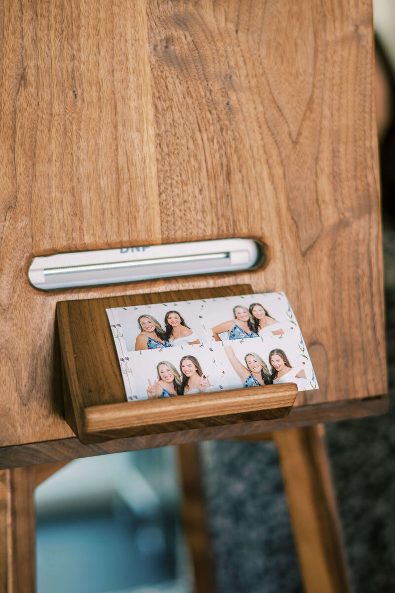 A close up of a photo printout from the Birdie Booth an open air photo booth rental for weddings and events.