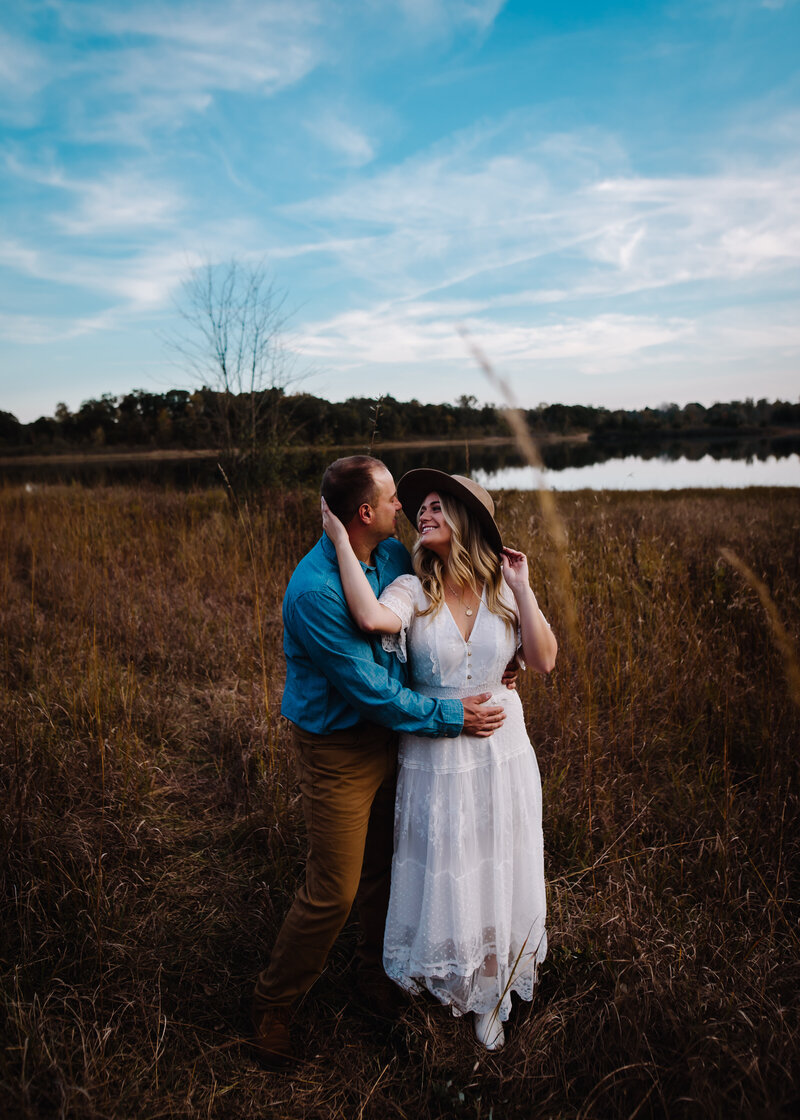 Couple shares a moment in a field