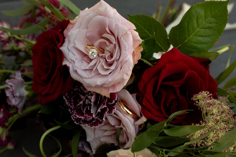 Rings Placed in Floral Arrangement for New Jersey Wedding