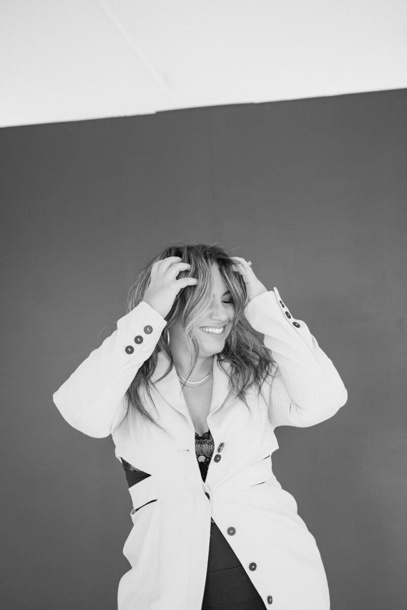 Nicole Nieves, founder of The Brand Vibe, smiling and ready to help entrepreneurs succeed