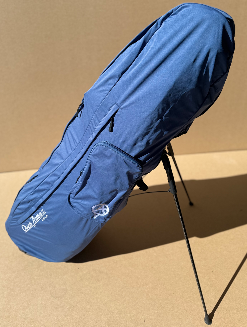 Water resistant golf bag cover by Over Armor Golf standing on golf course