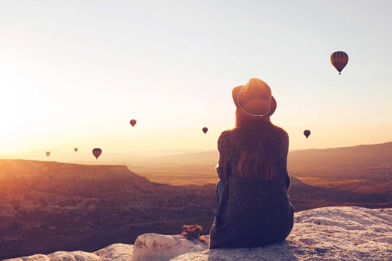 Woman gazing to horizon reflecting