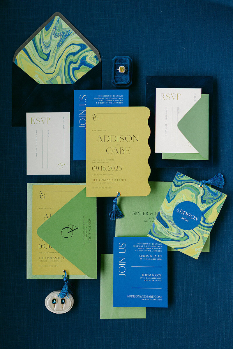 Soft blue linen flat lay mat styled with romantic paper goods and silk ribbon