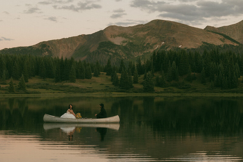 bridge and groom in canoe on water