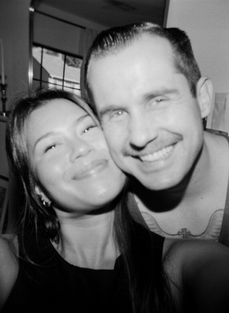 susan ly wedding photographer holding camera