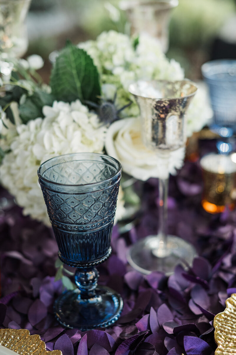 Close-up of vintage glasses and flowers